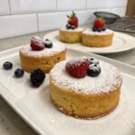 Assorted almond flour cakes with various toppings and flavors, showcasing healthy, gluten-free desserts perfect for any occasion.