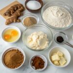 All ingredients for Gingerbread Cake with Sweet Molasses Frosting arranged on a kitchen counter