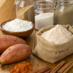 Ingredients for Sweet Potato Cinnamon Roll Cake including sweet potatoes, flour, sugar, and spices.