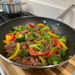 A colorful stir-fry featuring lean ground beef, mixed bell peppers, and broccoli, representing healthy ground beef recipes.