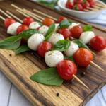 Caprese Skewers with cherry tomatoes, mozzarella, and basil - perfect picnic food ideas.